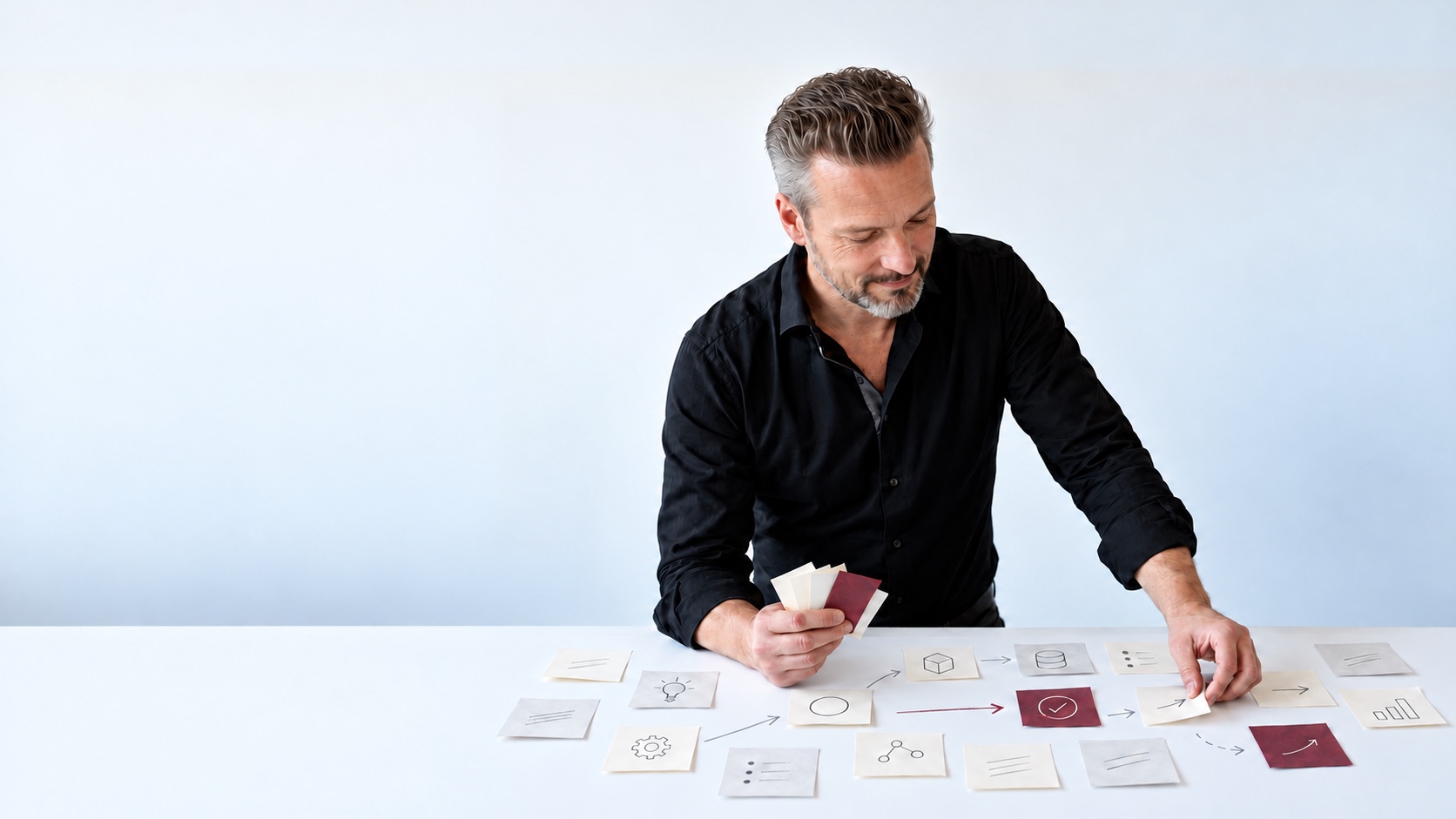 Andy Waar reviews Post-it notes on a table and organises the next steps